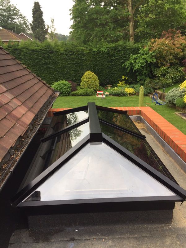 house with aluminium flat and lantern roofs