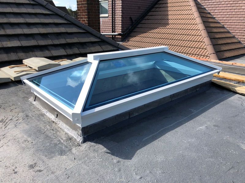 house with aluminium flat and lantern roofs